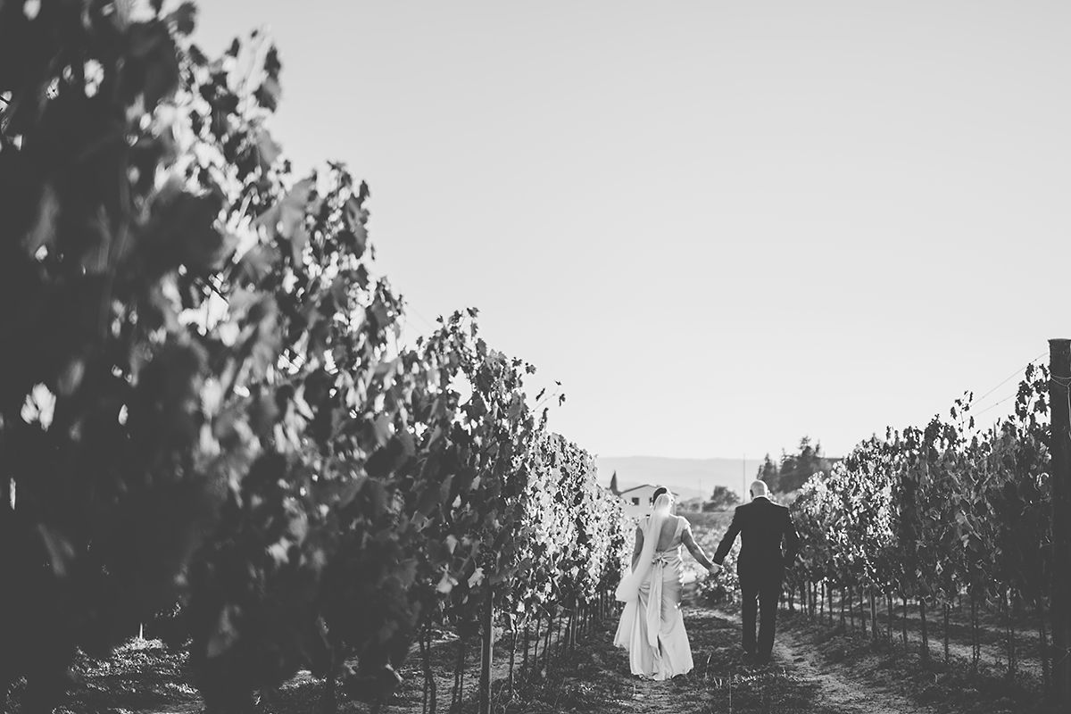Strolling through Tuscan vineyards- couples goals wedding photos
