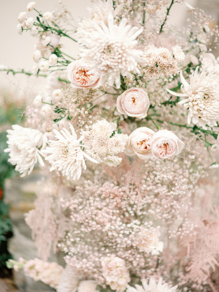Beautiful  Gypsophila wedding arch details in pastel pink and  almond tones